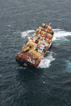 Rena stuck fast on Astrolabe Reef.