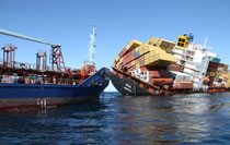 The oil tanker Awanuia reconnects to Rena, ready to take oil pumped from the stricken container ship.