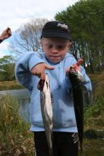 Rory Attwood aged 4 of Belfast with 2 salmon caught at last years Take A Kid Fishing
