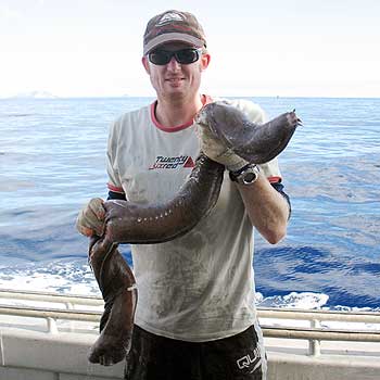 Te Papa researcher Carl Struthers with a hagfish.