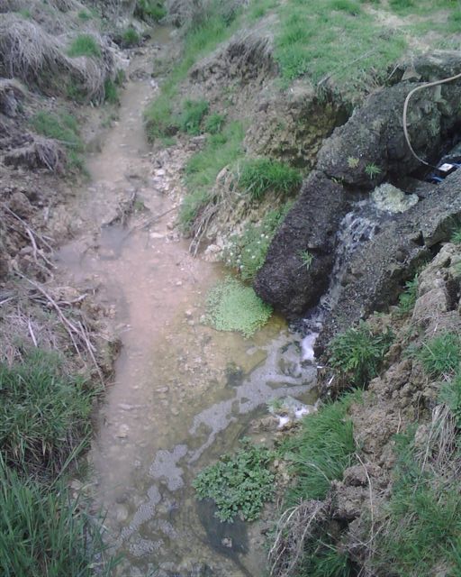 Treated sewage outlet showing meter in the middle (with wire running out of it) and the leaking flange