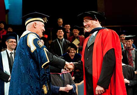 Chancellor Russ Ballard (left) presents the Honorary Doctorate to Sir Richard Taylor.