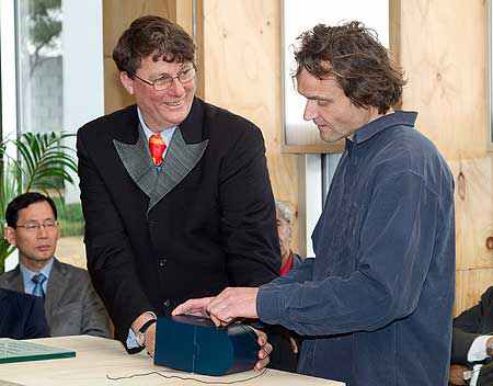 Sir Richard Taylor and Industrial Design Lecturer Matthijs Siljee compile the time capsule.  Sir Richard noted that he and Mr Siljee have taught students together in the past.