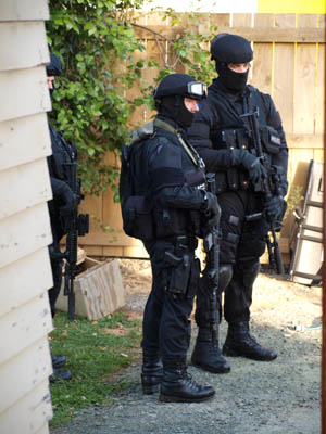 Armed Offenders at gang pad after this morning's raid.