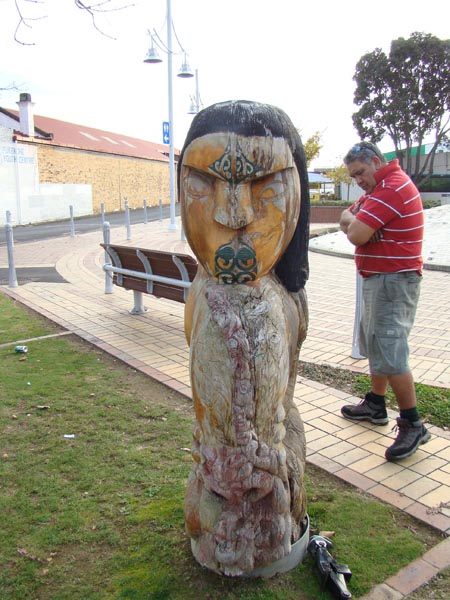 Master Carver Ted Ngataki inspects the current state of the Papatuanuku carving in the Pukekohe Town Square.