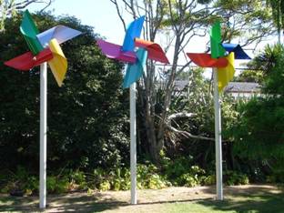 Leon van den Eijkel and his sculpture The Smiling Windmills 