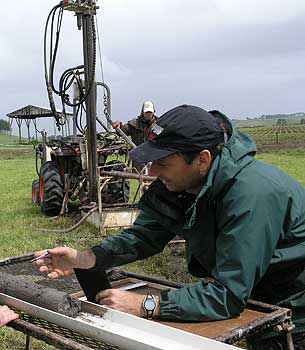 Professor Shane Cronin describes part of a core sample containing  volcanic ash layers taken from near Eltham.