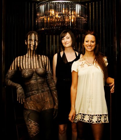 A model painted to exactly match the interior of the Westin Hotel is pictured with Urbis editor Nicole Stock and designer Lucie Boshier.