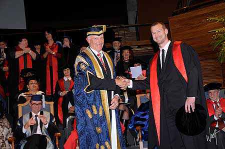 Dr Paul Wood receives his doctorate from Massey University Chancellor Dr Russell Ballard
