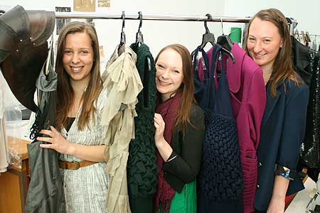 From left, Brita Dellabarca, Claire Walker and Victoria Green with some of their designs that will feature at the annual Massey Fashion Show in November.