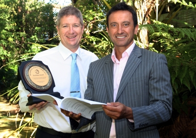 Taranaki Regional Council Chairman David MacLeod (right) and Director-Corporate Services, Mike Nield, with the Excellence Award and the report that was presented to the Geospatial World Forum.