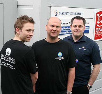 Todd Balogh (left) is hoping to take up postgraduate studies with the Joint Centre for Disaster Research. He models the T-shirt, with postgraduate diploma candidate Mark Mitchell (centre) and senior tutor Steve Glassey.