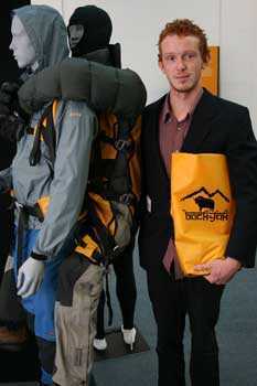 Nick Graham alongside a model showing how  his backyak design works.