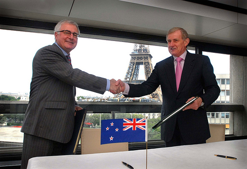 New Zealand Trade Minister Tim Groser (left) and his Australian counterpart Simon Crean at the signing of the new New Zealand and Australian double tax agreement in Paris early today New Zealand time, with the Eiffel Tower in the background 