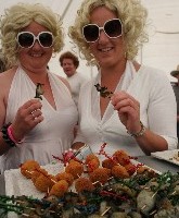 Hokitika Wildfoods Festival-goers sample local "fruits of the sea".