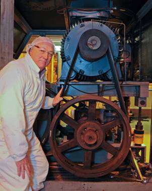 Fonterra's General Manager New Zealand Manufacturing Brent Taylor inspects the drive system of one of Clandeboye's milk homogenisers during winter maintenance.