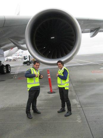 Andee Nanai (left) and Lafi Loia (right) standing in front of the Emirates A380