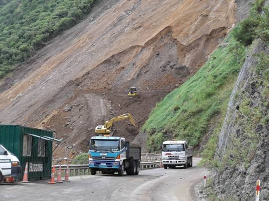 Road crews taking material away from the river.