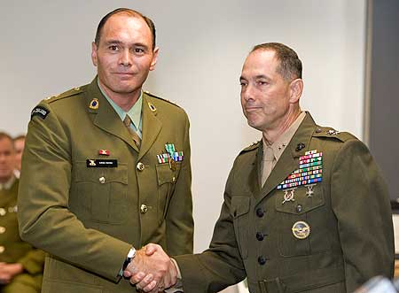Lieutenant Colonel Oiroa Kaihau (left) is presented with the Meritorious Service Medal by United States Marine Corps General Peter Talleri.