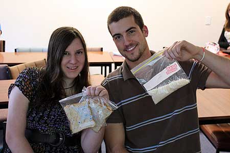 Massey students Rebecca Butler and Grant Weherley with their food for the day.