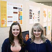 Digital and advertising design students Lisa Martin  and Natasha Godetz with their arthritis  awareness exhibit.