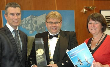 Hutt City Council Chief Executive Tony Stallinger, Lower Hutt Mayor Ray Wallace and Council's Organisational Performance and Risk Manager May Haines with the gold Business Excellence trophy and winning application. 