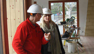 Advice that pays: Eco design advisor Sarah Fleet checks on prgress of a home.