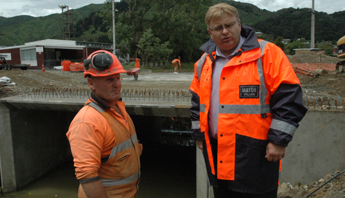 Lower Hutt Mayor Ray Wallace inspects the new storm water protection works in Fitzherbert Road, Wainuiomata, with site supervisor Lyall Patton of Riverside Construction.