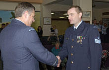 01 F/S Andrew Forster being presented with the NZ Operational Service Medal (Left) and NZ General Service Medal Afghanistan (Right) by Air Vice Marshal Graham Lintott, Chief of Air Force.