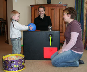 Child plays with the Magic Shrinking Machine.