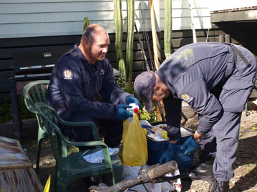 Police sift through rubbish as part of search warrant on a Mapua property today.