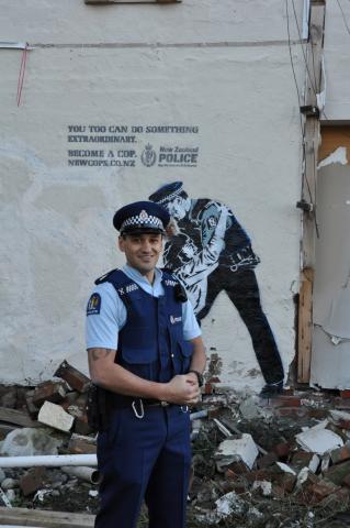 Constable Spence Kingi with the street art installation on Montreal Street