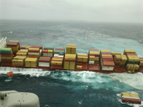 Aerial shot showing Rena leaning starboard with containers spilled in foreground