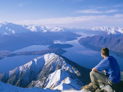 A hiker takes in views over Lake Wanaka.