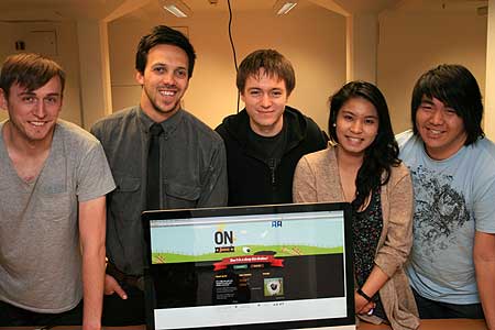 Third year Bachelor of Design students from left, Ben Wright, Kieran Stowers, Chris Nicholls, Joy Roxas and Vincent Lee display the On The Fence online tool.