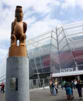 Four Maori tekoteko carvings stand guard over Eden Park